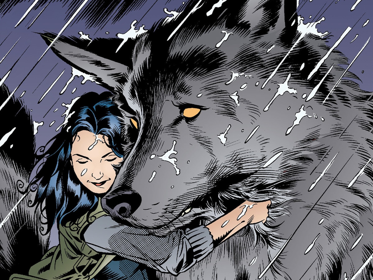 Woman hugging a huge wolf