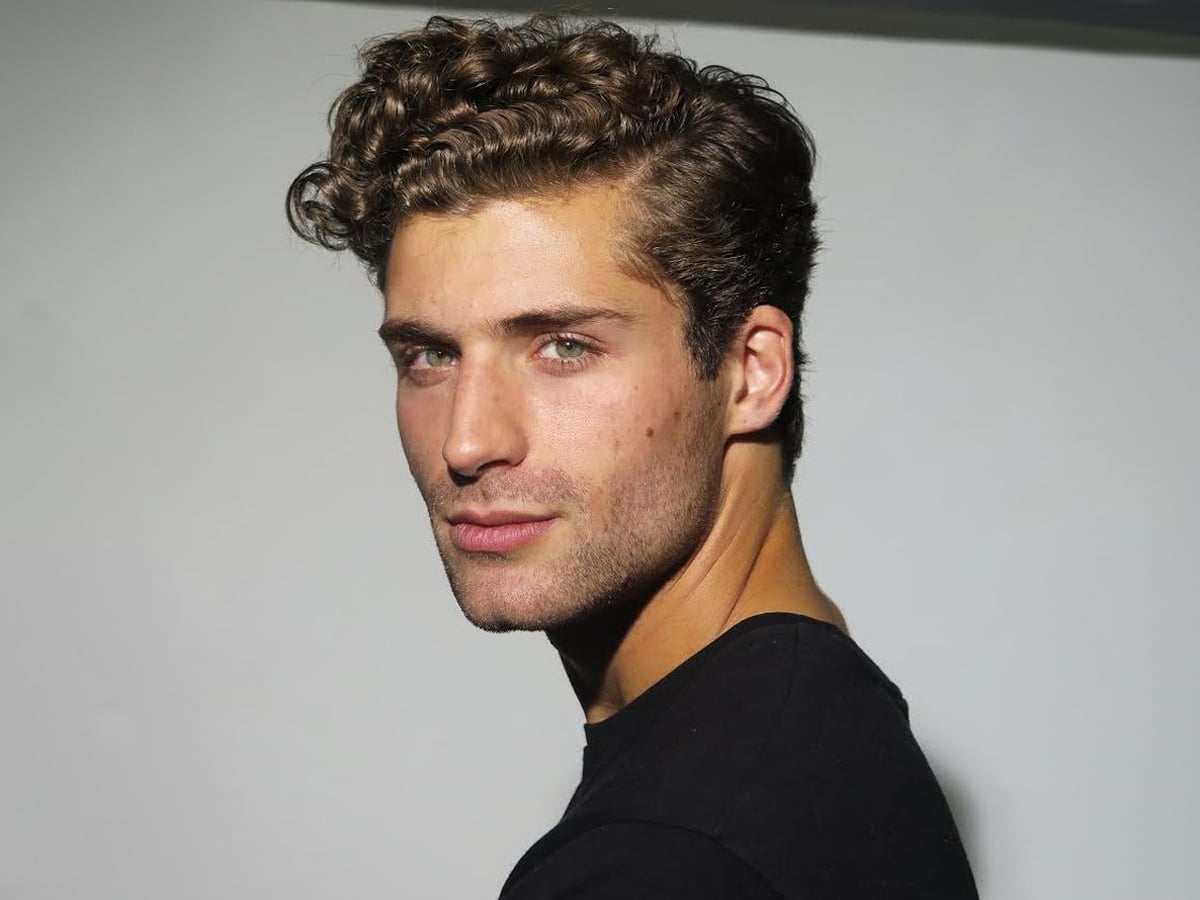 Man with curly side part hairstyle