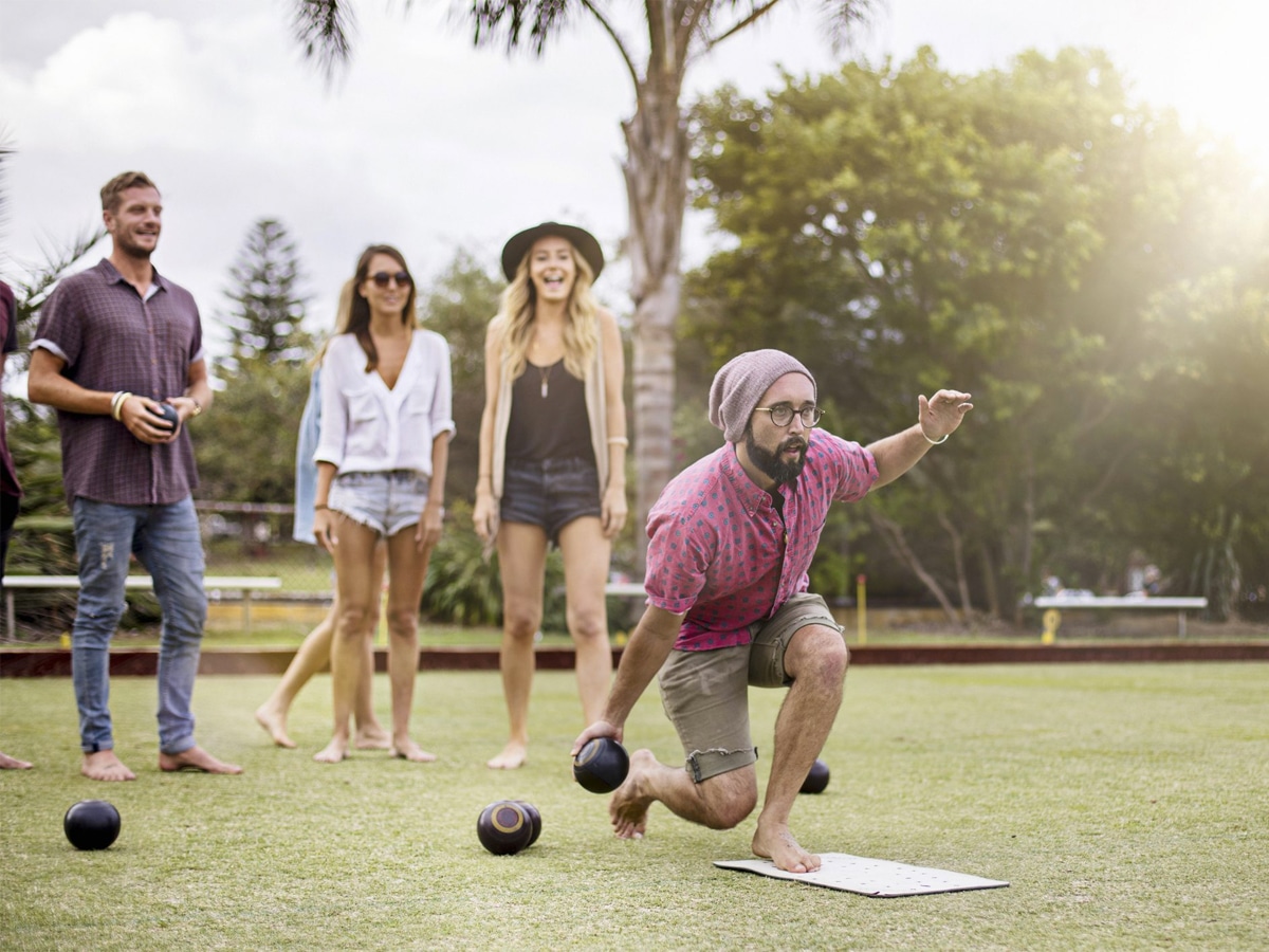 Group of people doing barefoot bowling