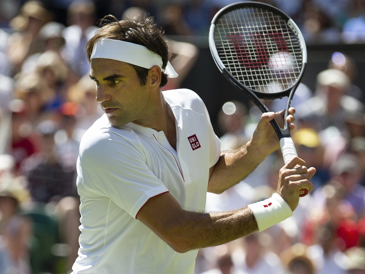 Roger Federer holding a tennis racket