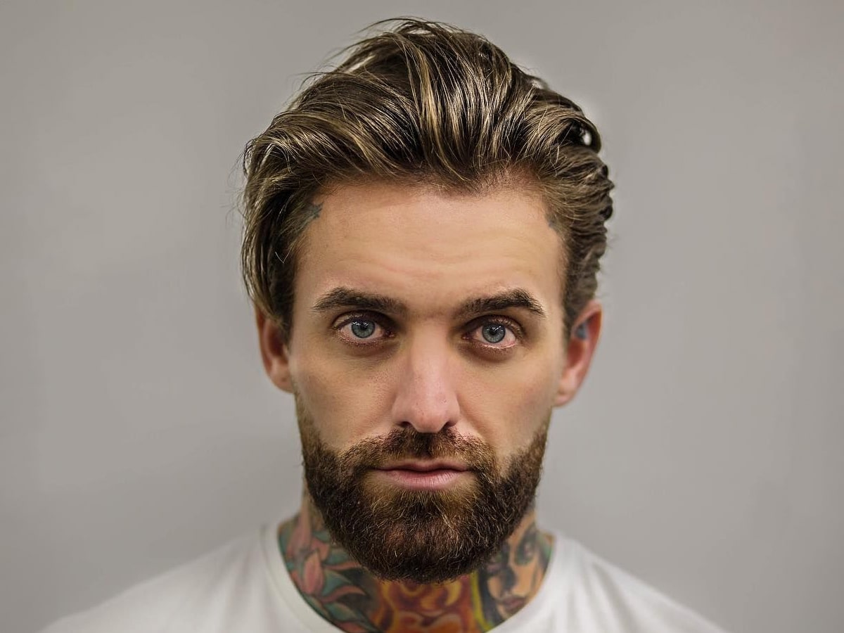 MMA fighter Aaron Chalmers with a slick back medium-length hairstyle