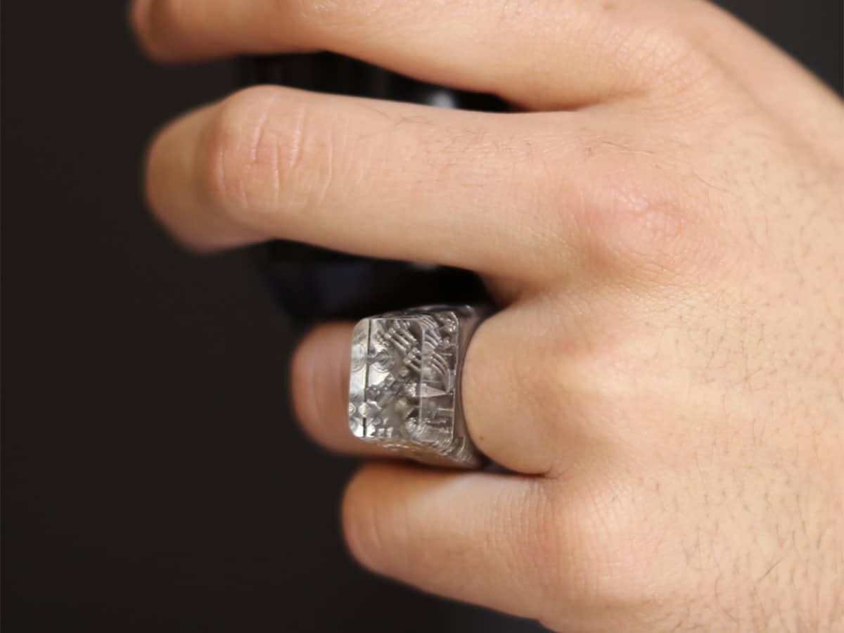 Hand wearing silver Teti ring