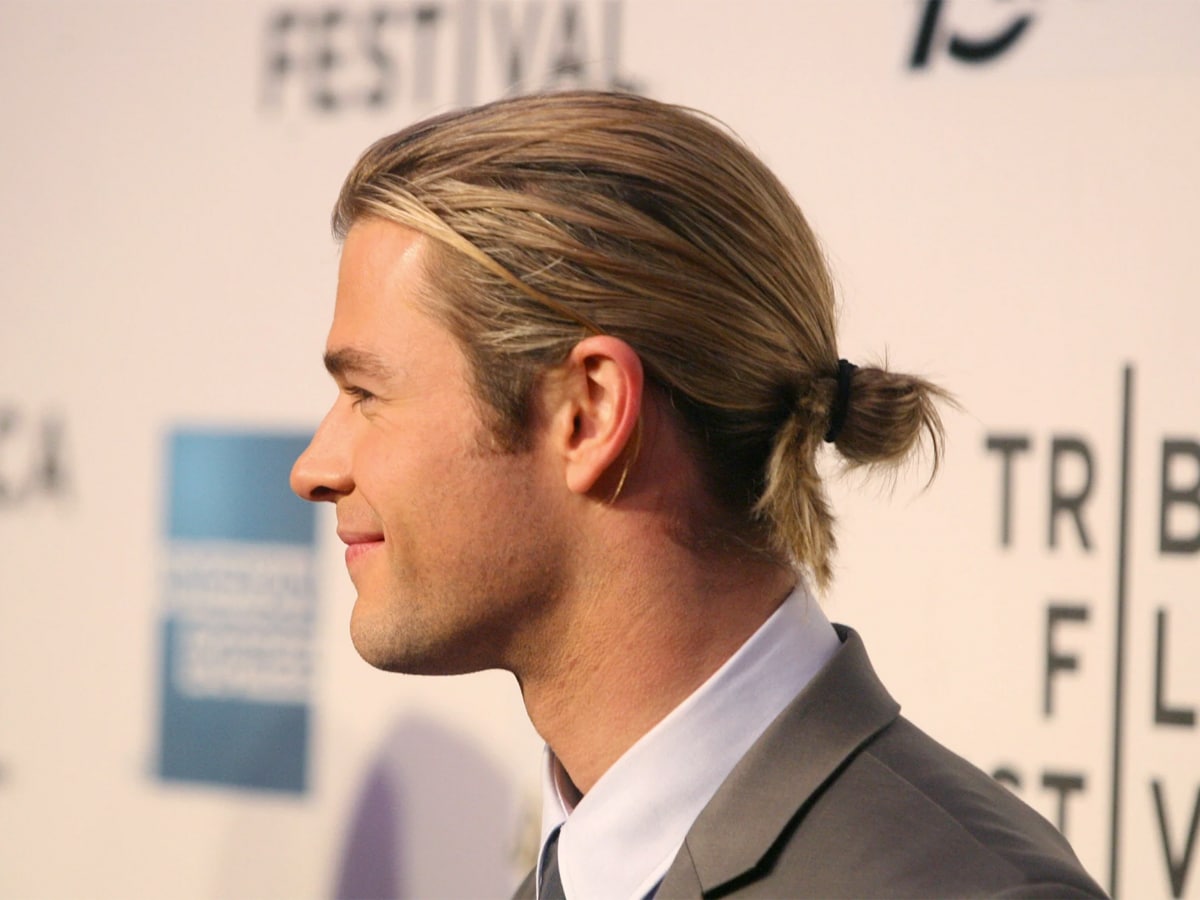 Chris Hemsworth with a man-bun hairstyle