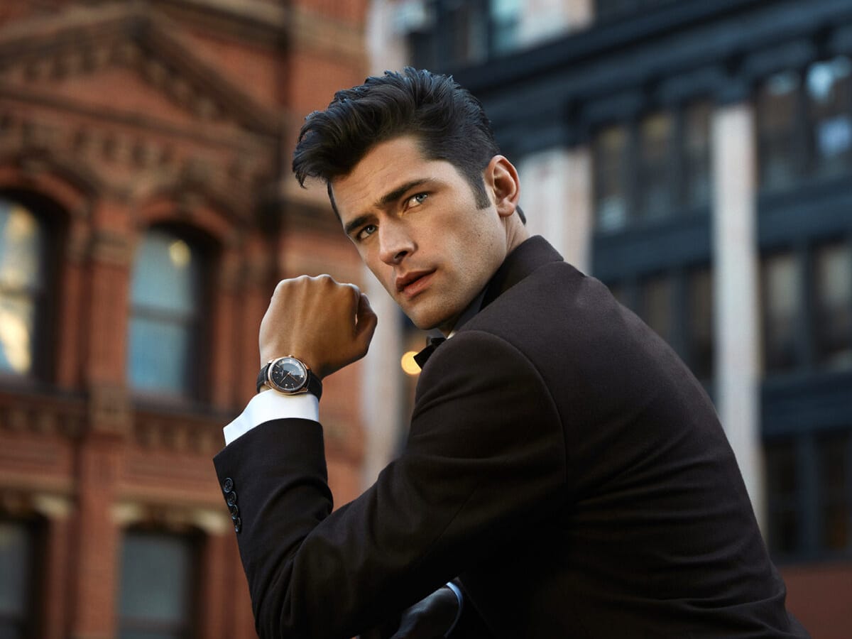 Sean O’Pry in a black suit wearing a watch