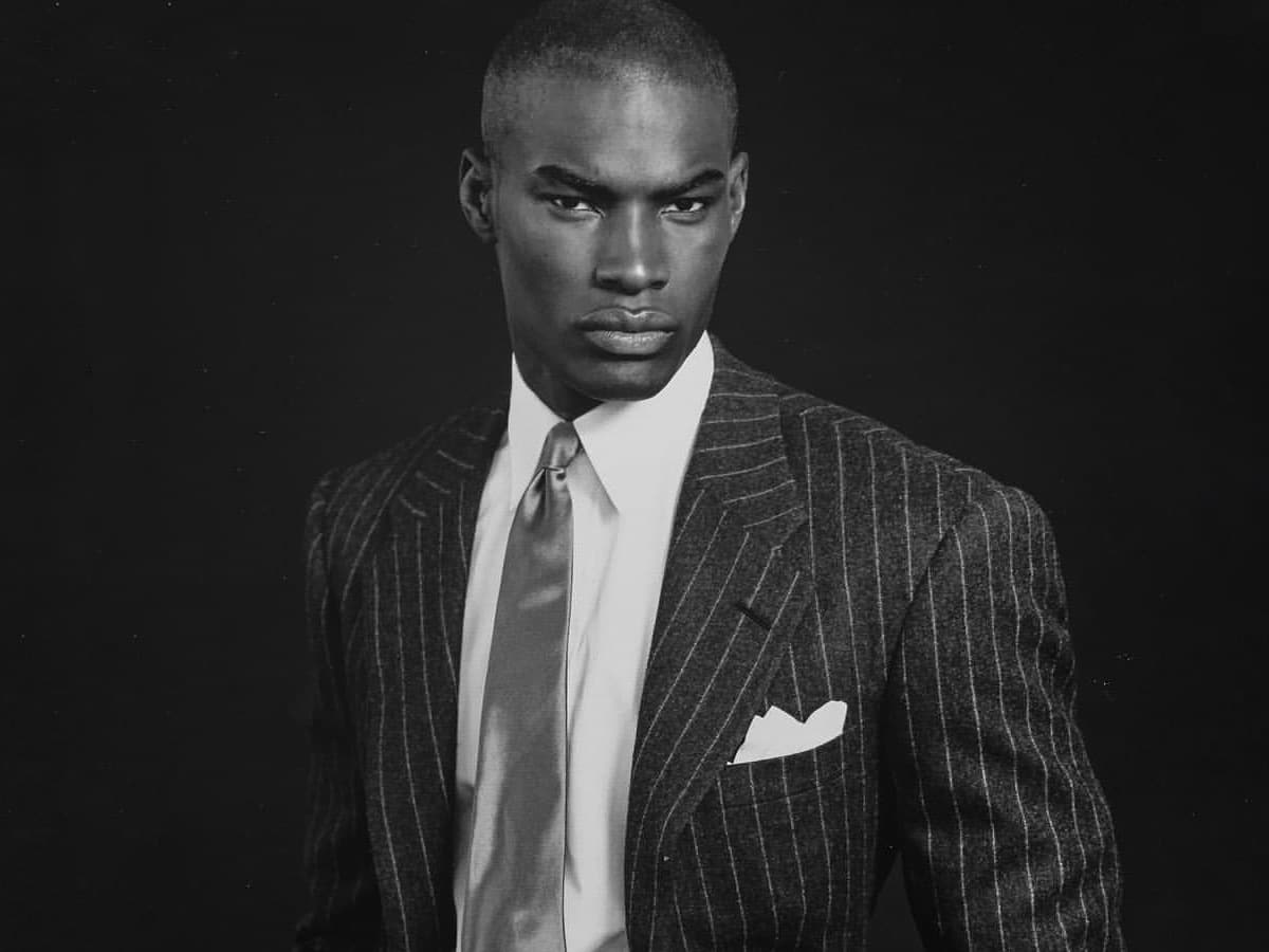Greyscale image of Tyson Beckford in a patterned suit