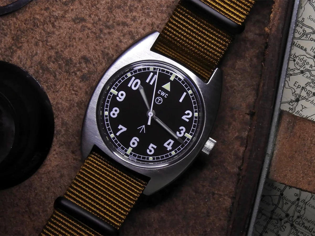 Silver CWC watch with brown strap
