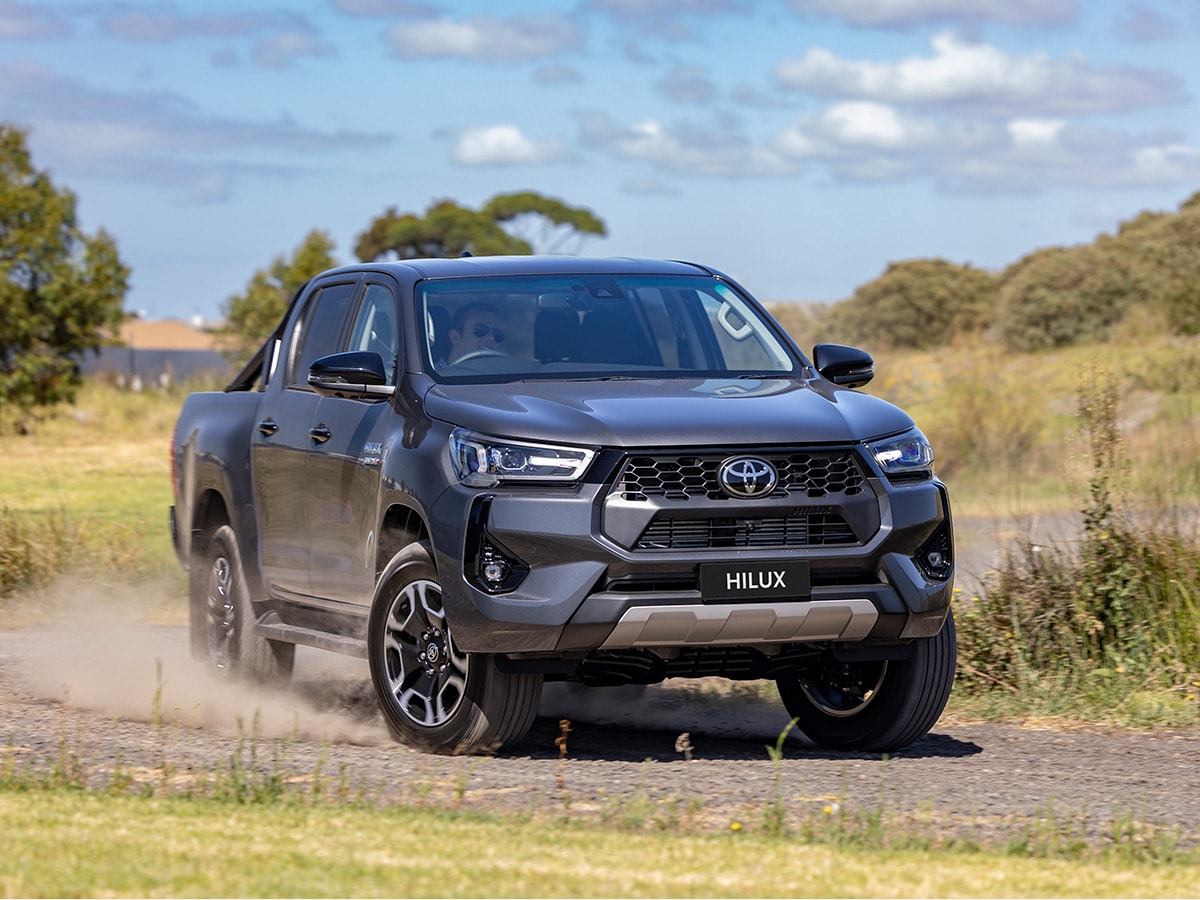 2024 toyota hilux driving on the road