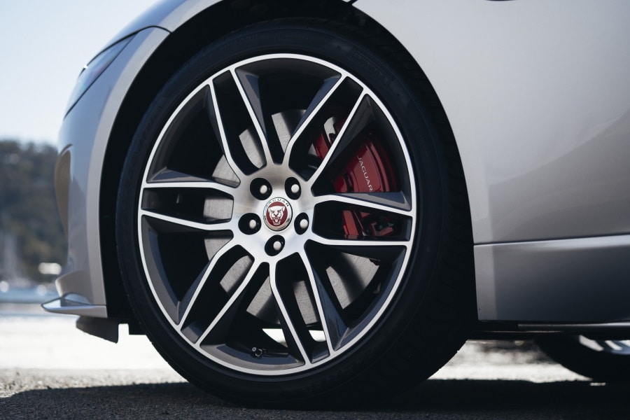 Front wheel of the 2021 Jaguar F-type showing the maroon Jaguar logo