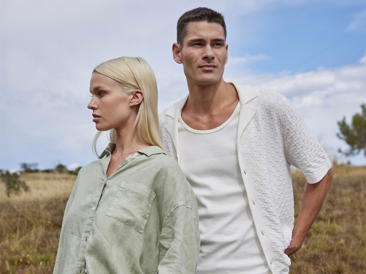 Male and female model wearing neutral coloured clothes