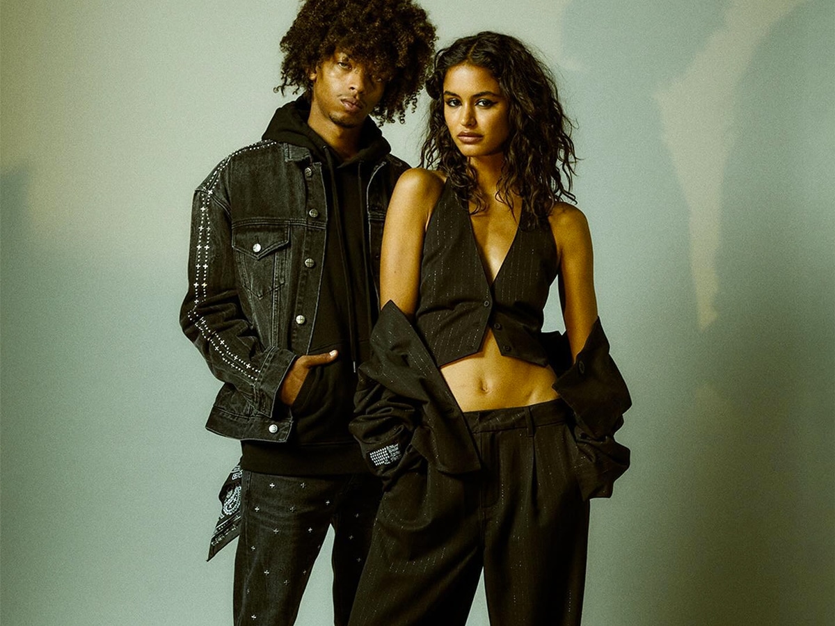 Male and female model wearing black outfit