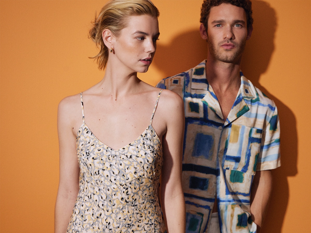 Male and female models wearing printed outfits