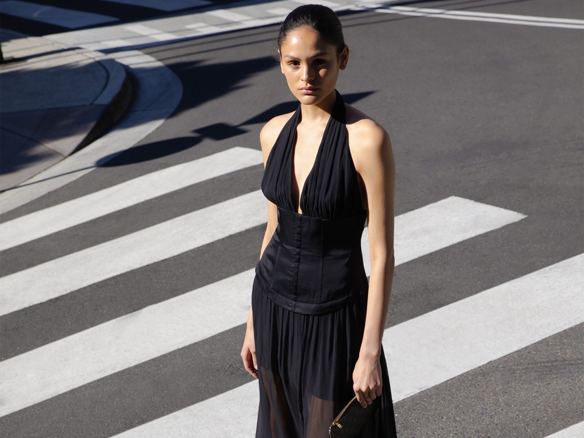 Female model wearing black dress