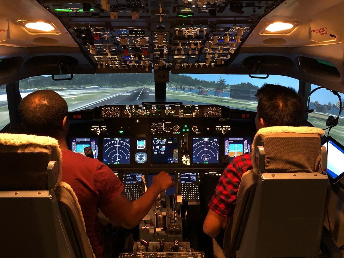 Two men in a Virtual Pilot simulation