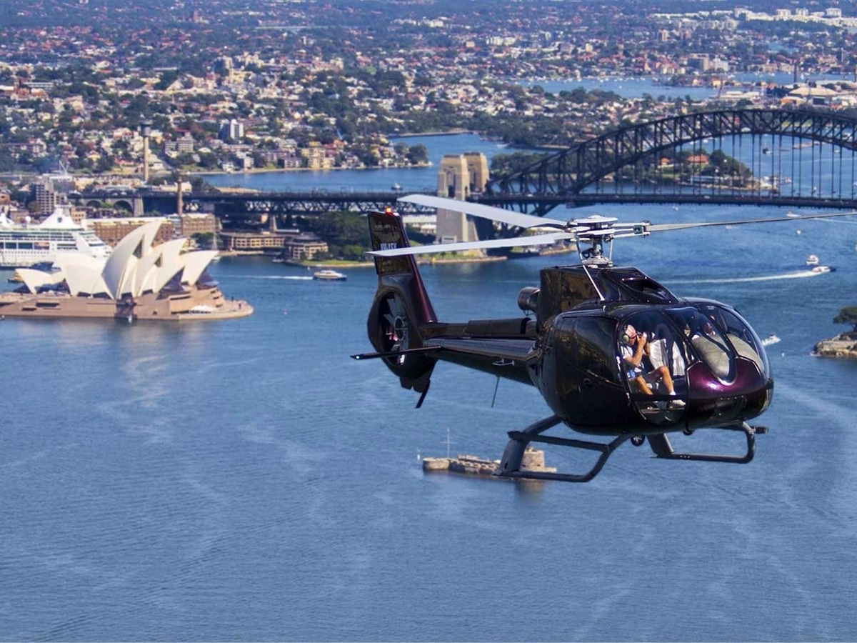 Helicopter flying over Sydney Opera House