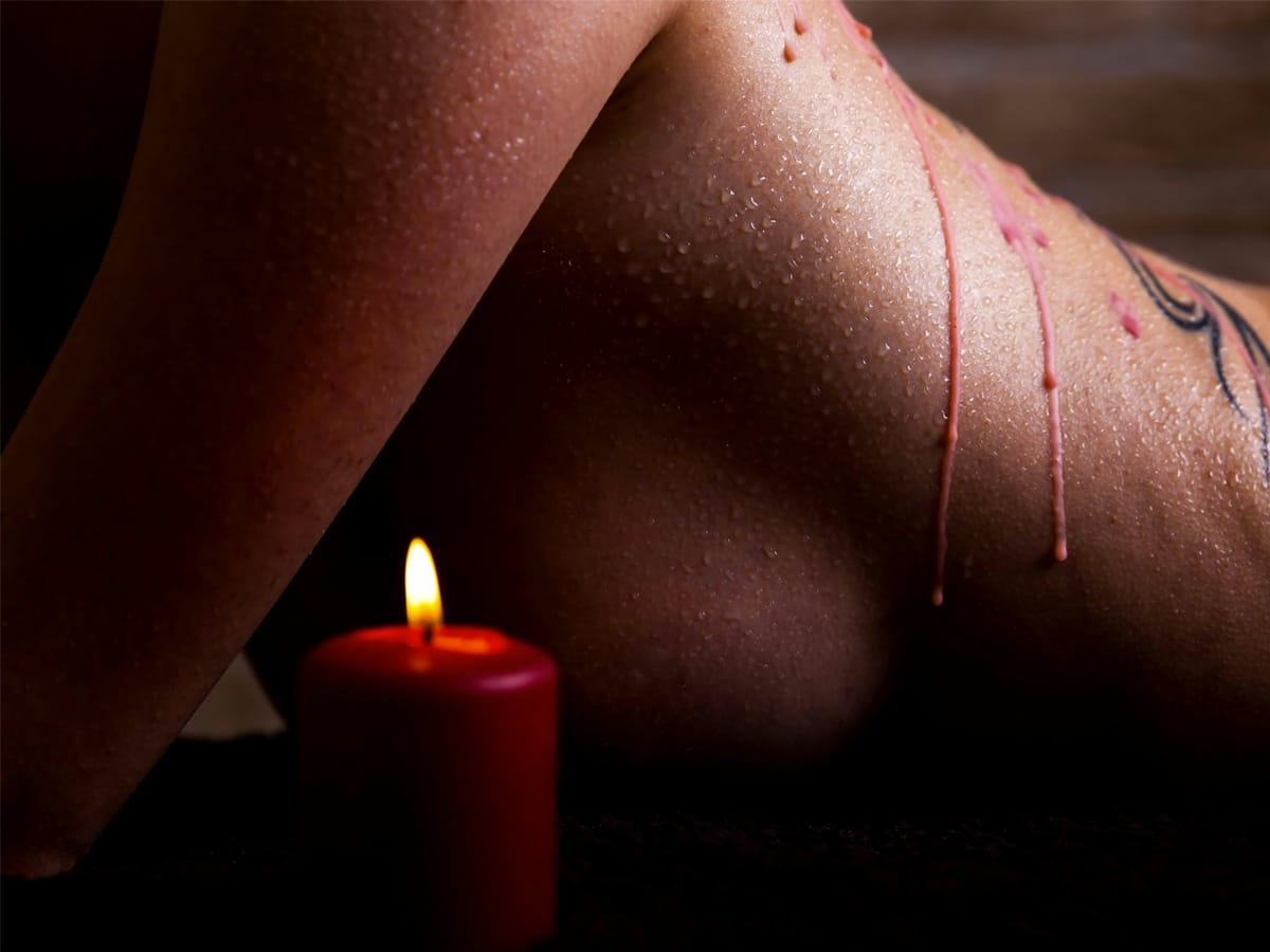 Dried candle wax on a woman's back