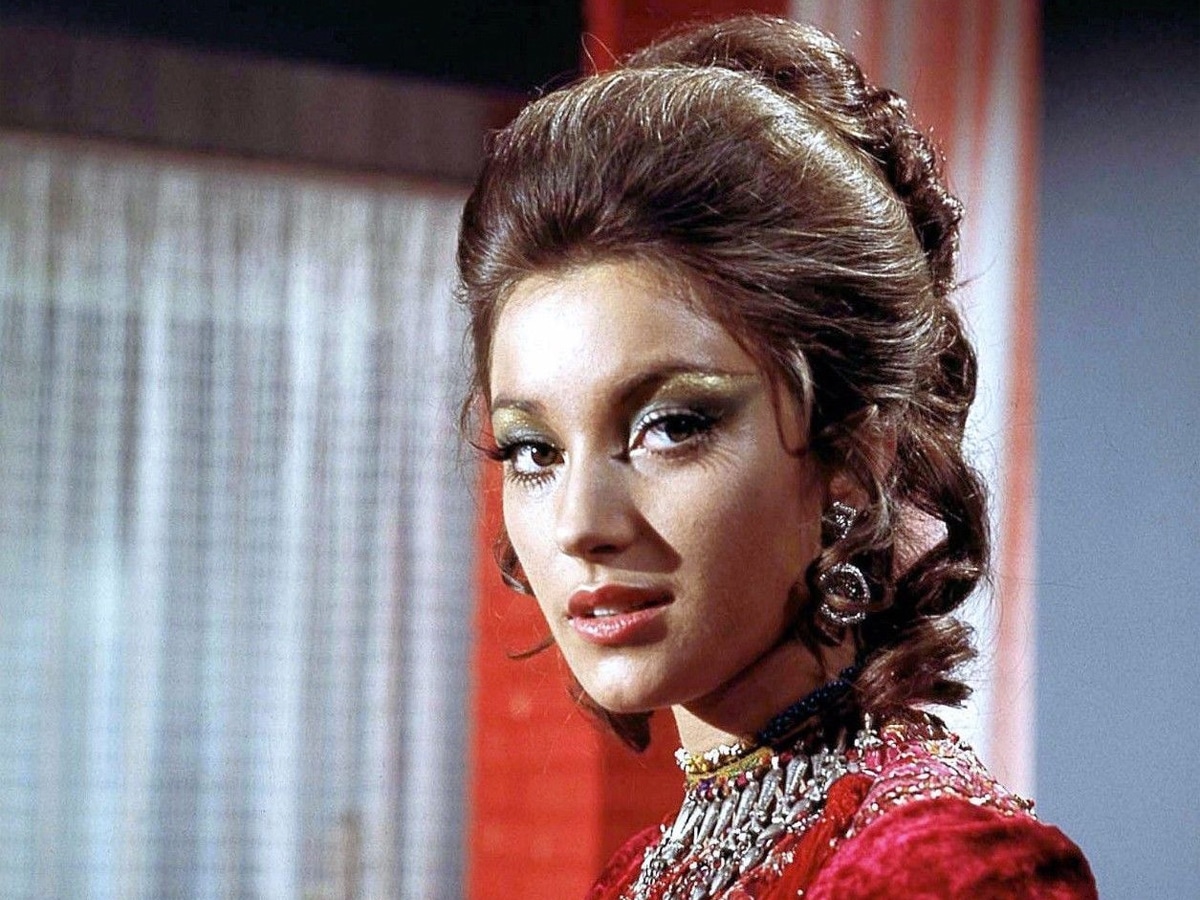 Jane Seymour wearing fancy makeup and red outfit