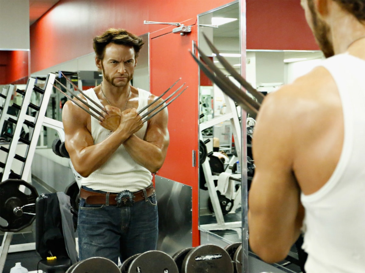 Hugh Jackman as Wolverine looking at his reflection in the mirror