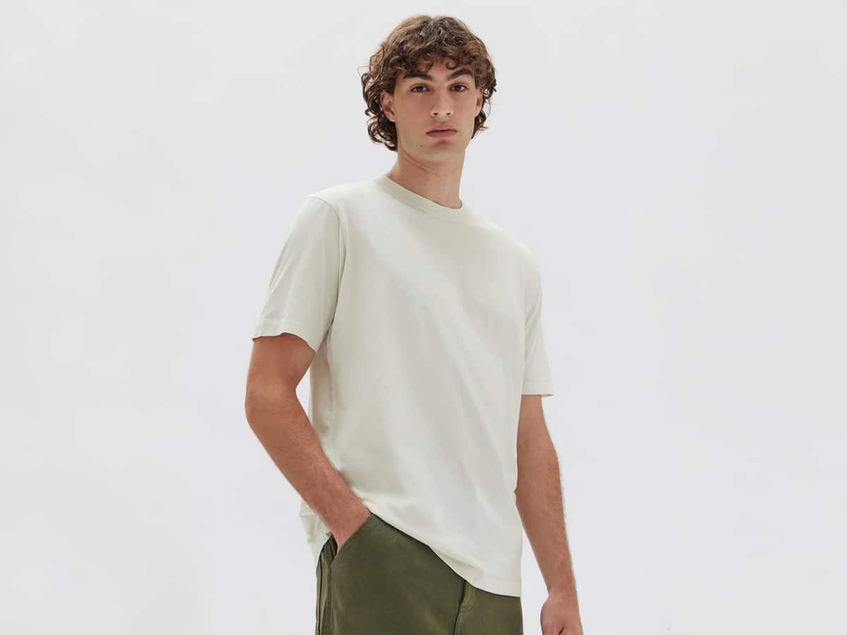 Male model in a white shirt and green shorts
