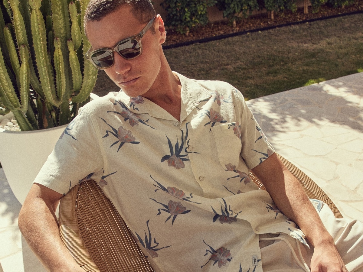 Male model in a white flower patterned shirt