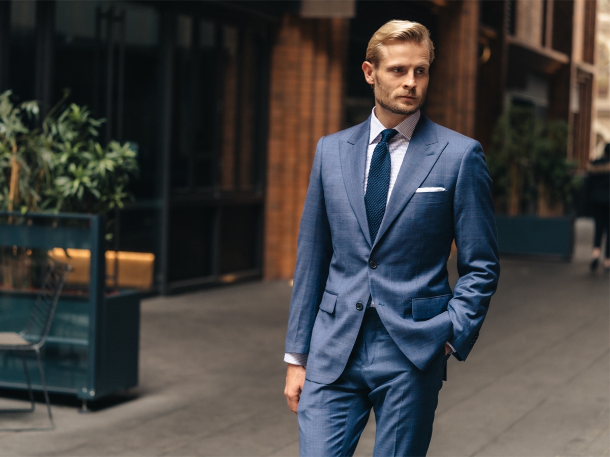Male model in a blue patterned suit