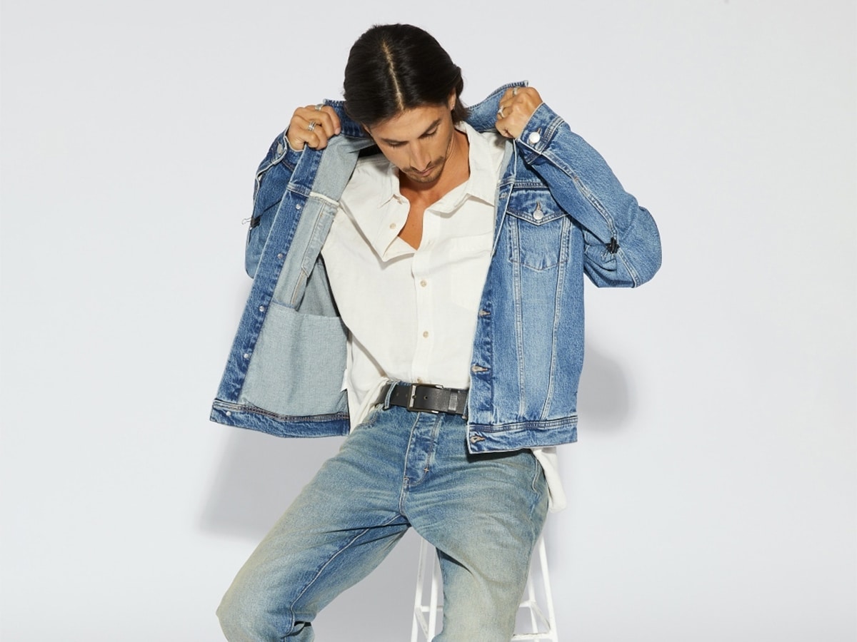 Male model in a white shirt and denim jacket and pants