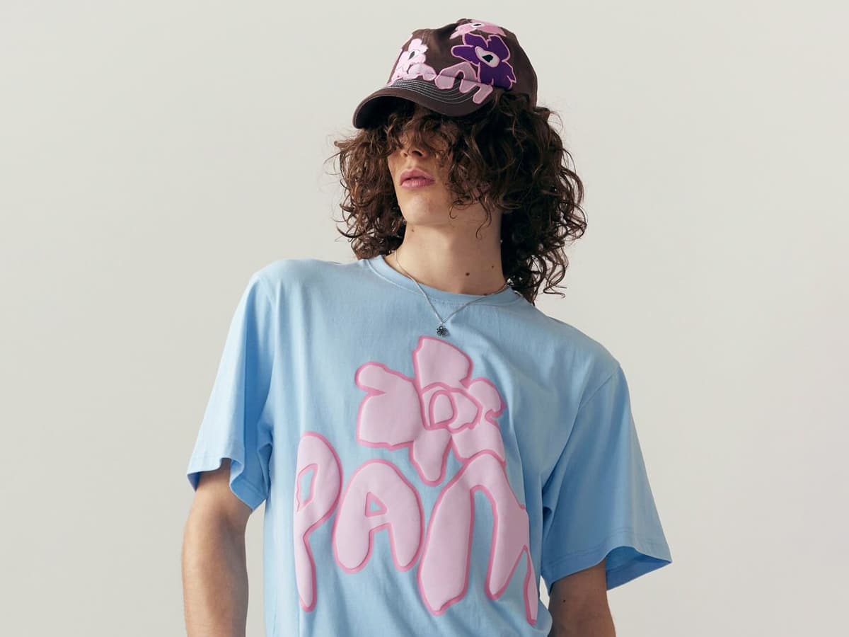Male model in a graphic t-shirt and cap