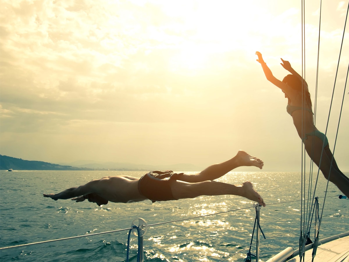 Man and woman jumping from a cruise ship