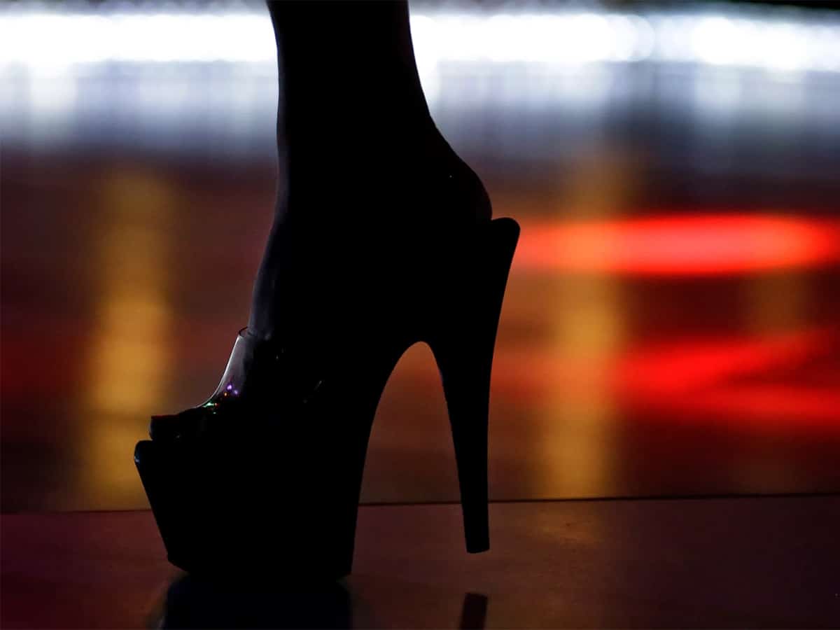 Silhouette of a woman's foot in heels