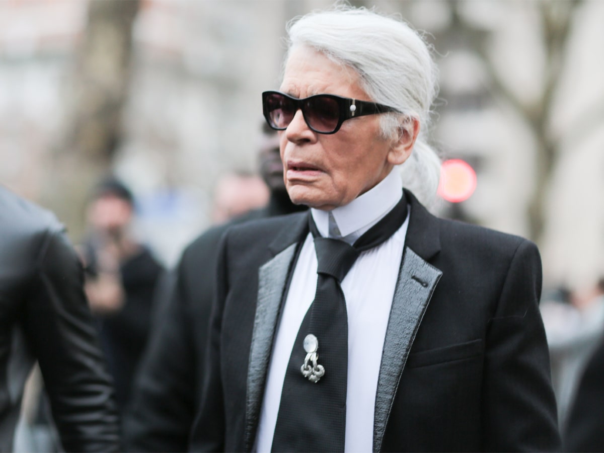 Karl Lagerfeld in a black and white suit