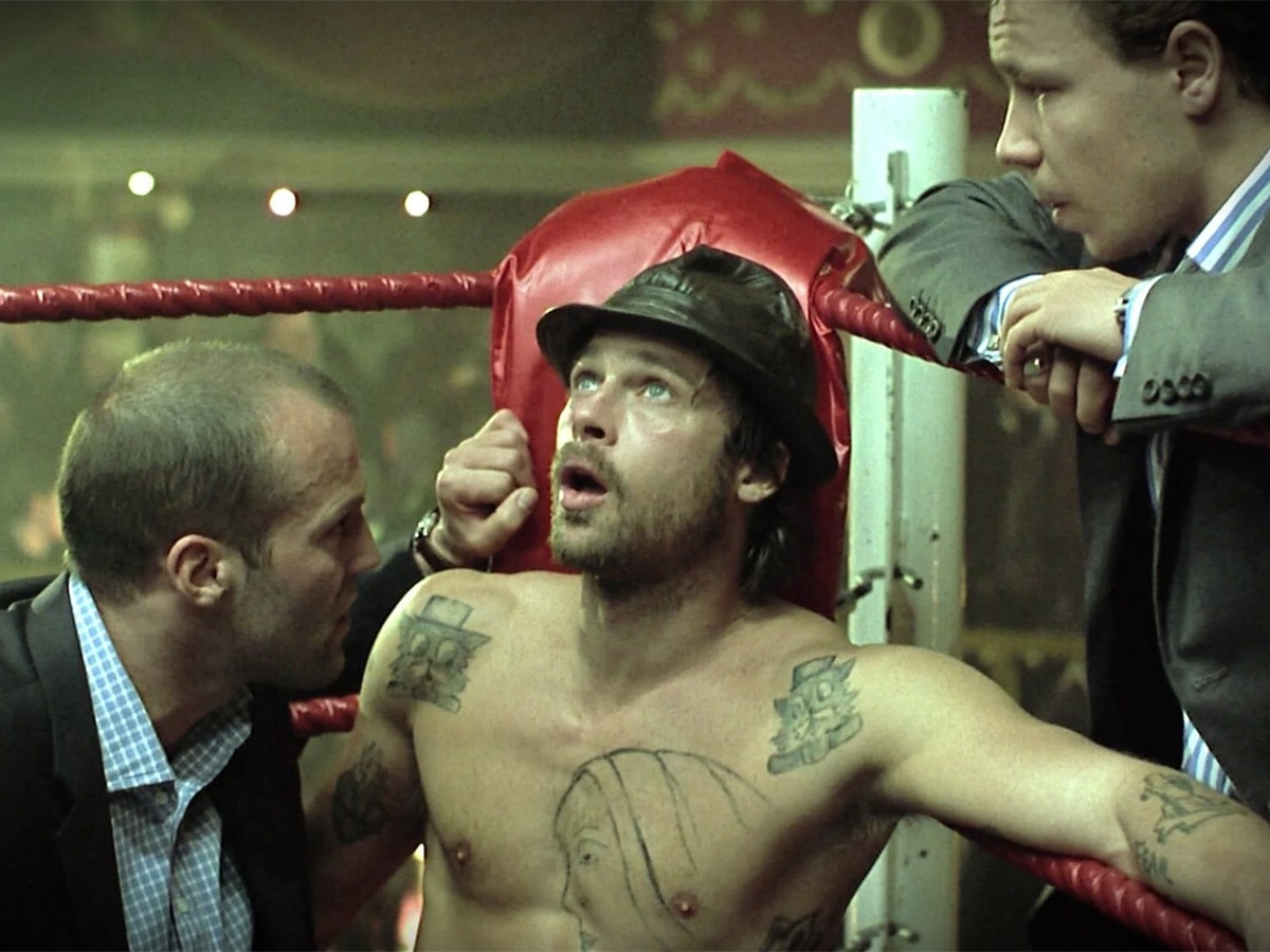 Brad Pitt on the red corner of a boxing ring
