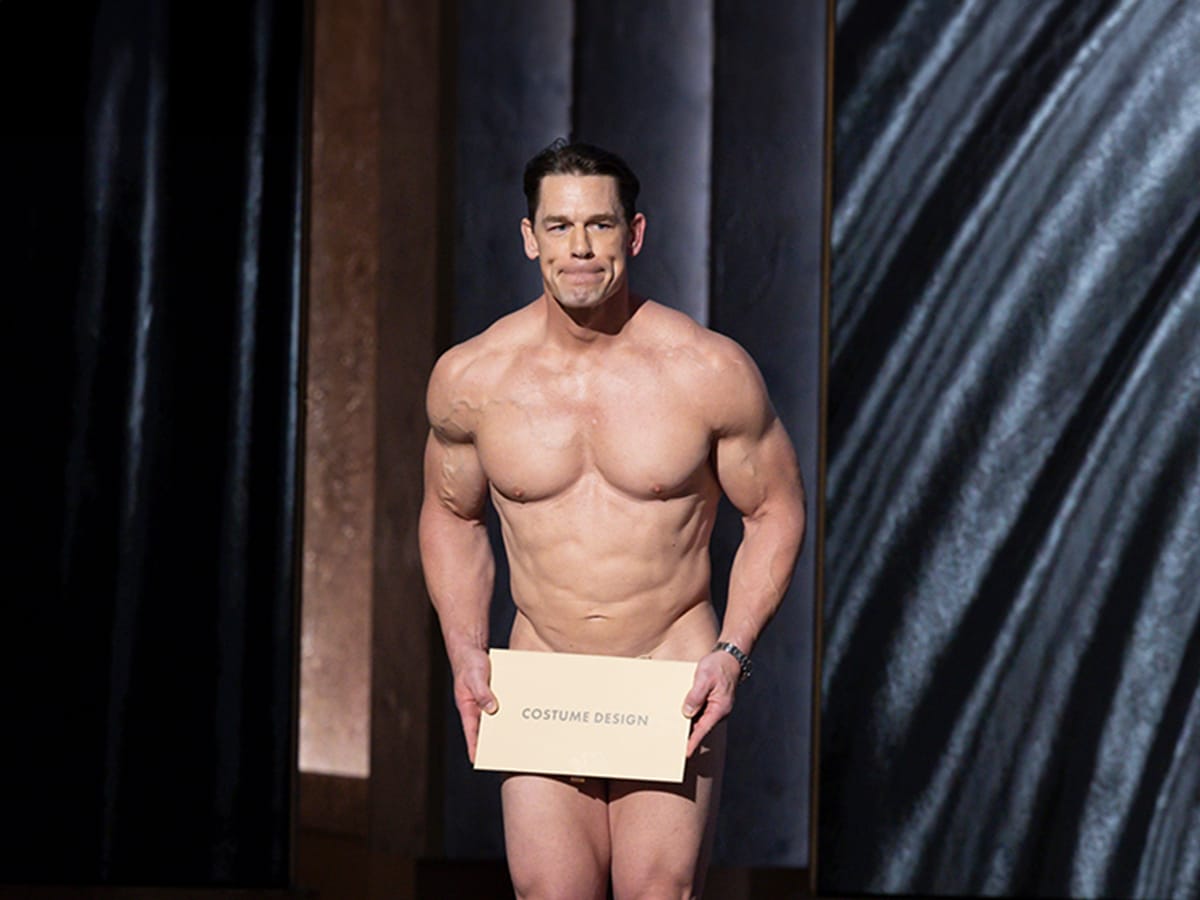 John Cena presents the award for Best Costume Design at the 2024 Academy Awards in Los Angeles