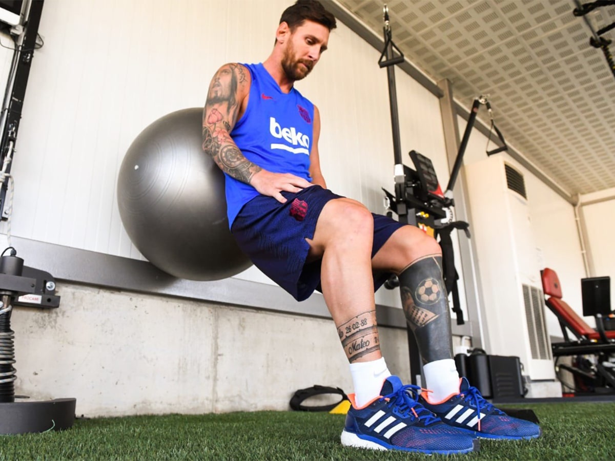 Lionel Messi working out with a stability ball
