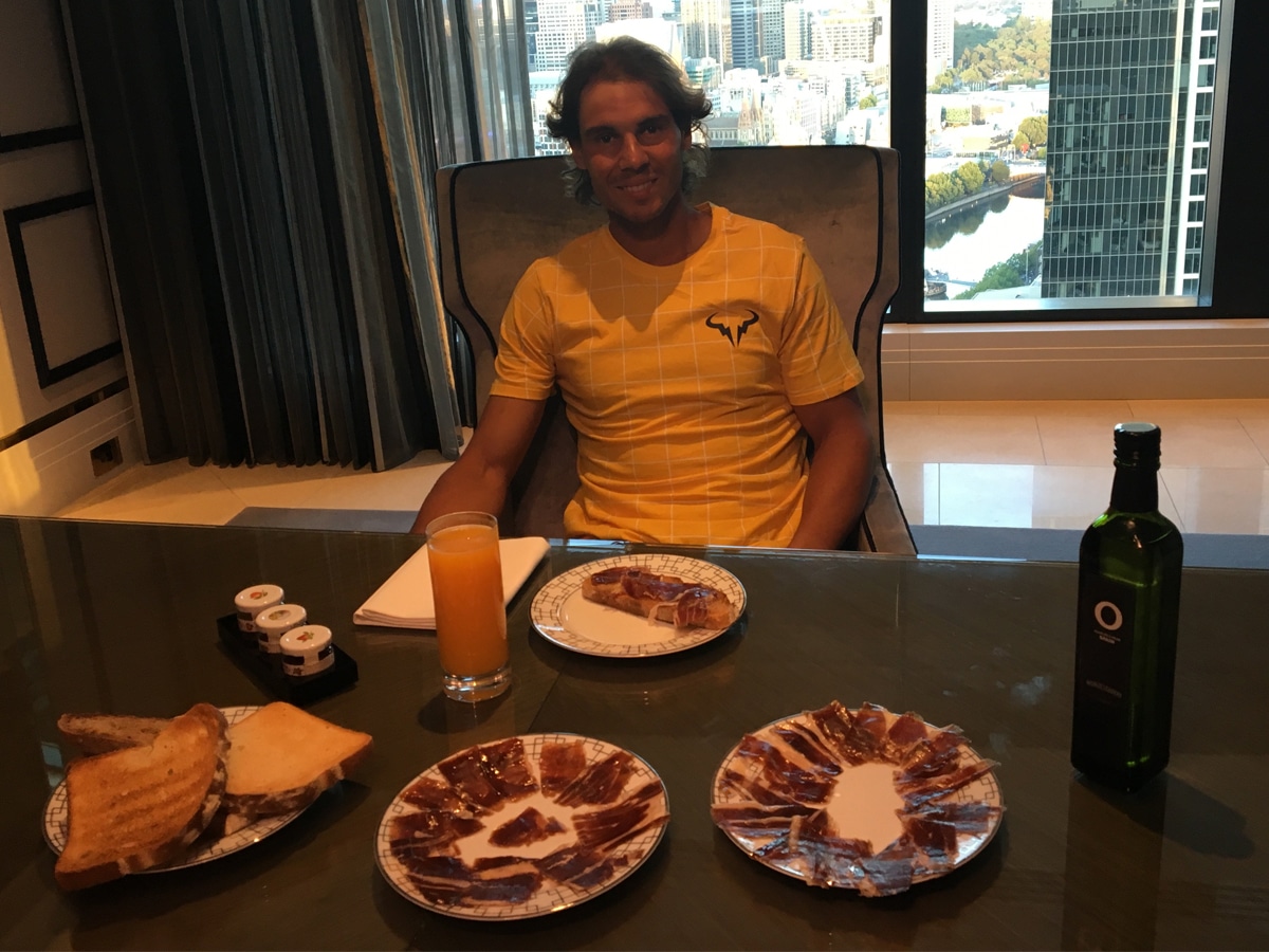 Rafael Nadal with his meal on the table