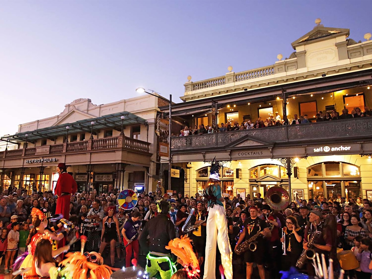 Crowd of people watching buskers at the Fremantle International Street Arts Festival