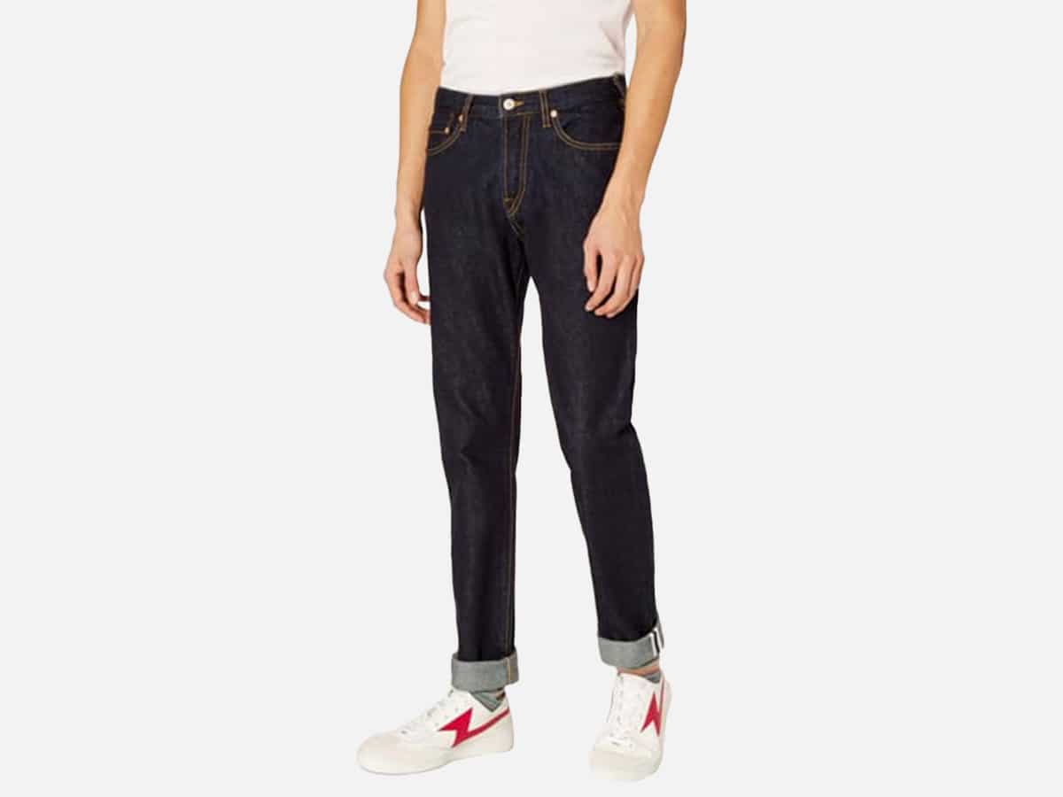 Male model in PS Paul Smith Tapered-Fit 13oz ‘Pink Selvedge’ Indigo Denim Jeans