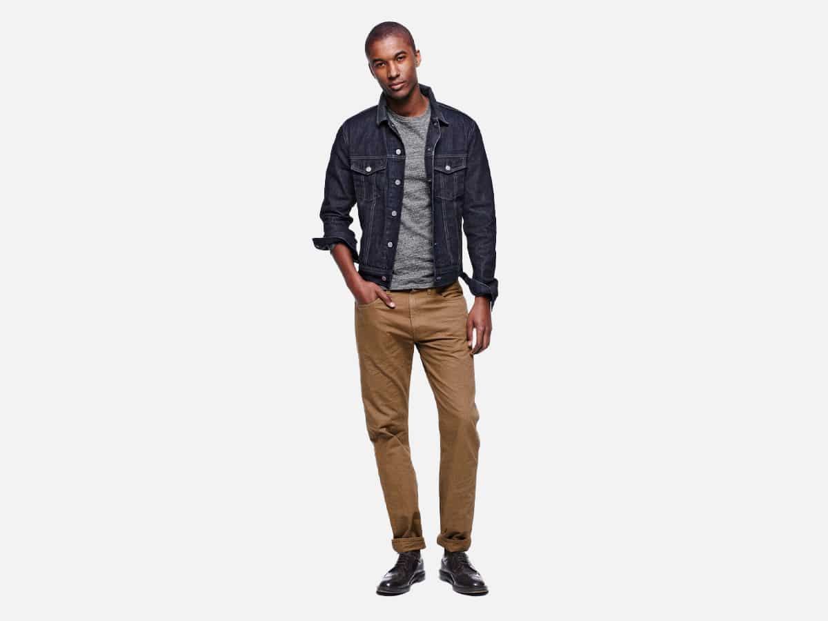 Male model in selvedge denim jacket with chinos