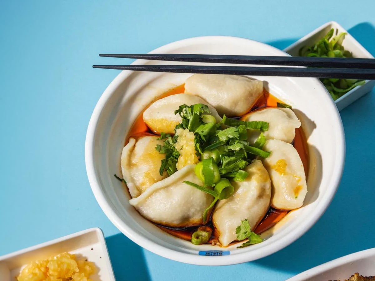 Dim sum on a bowl with light blue background