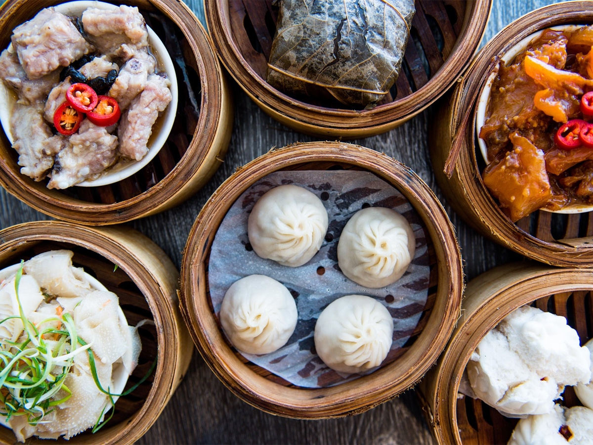 Chinese and Asian-fusion dishes on a wooden table
