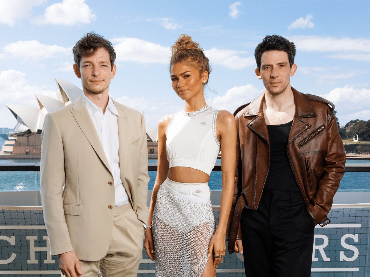 Challengers cast, Mike Faist, Zendaya and Josh O'Connor posing in Sydney in front of Sydney Harbour.