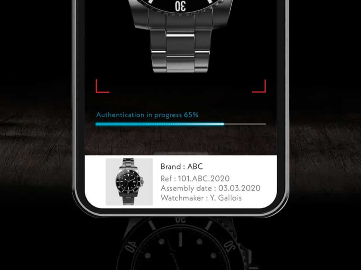 Smartphone showing ORIGYN app with dark background