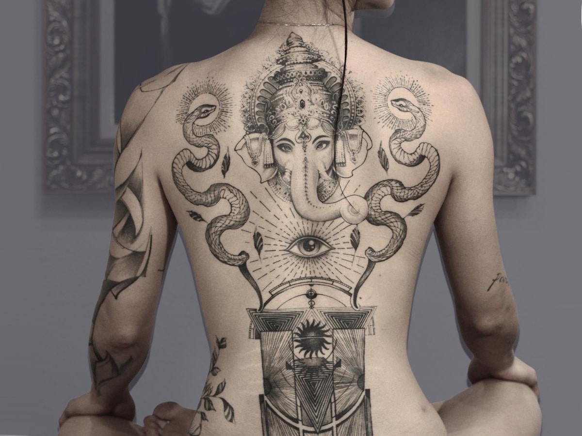 elephant art tattoo on a woman's back