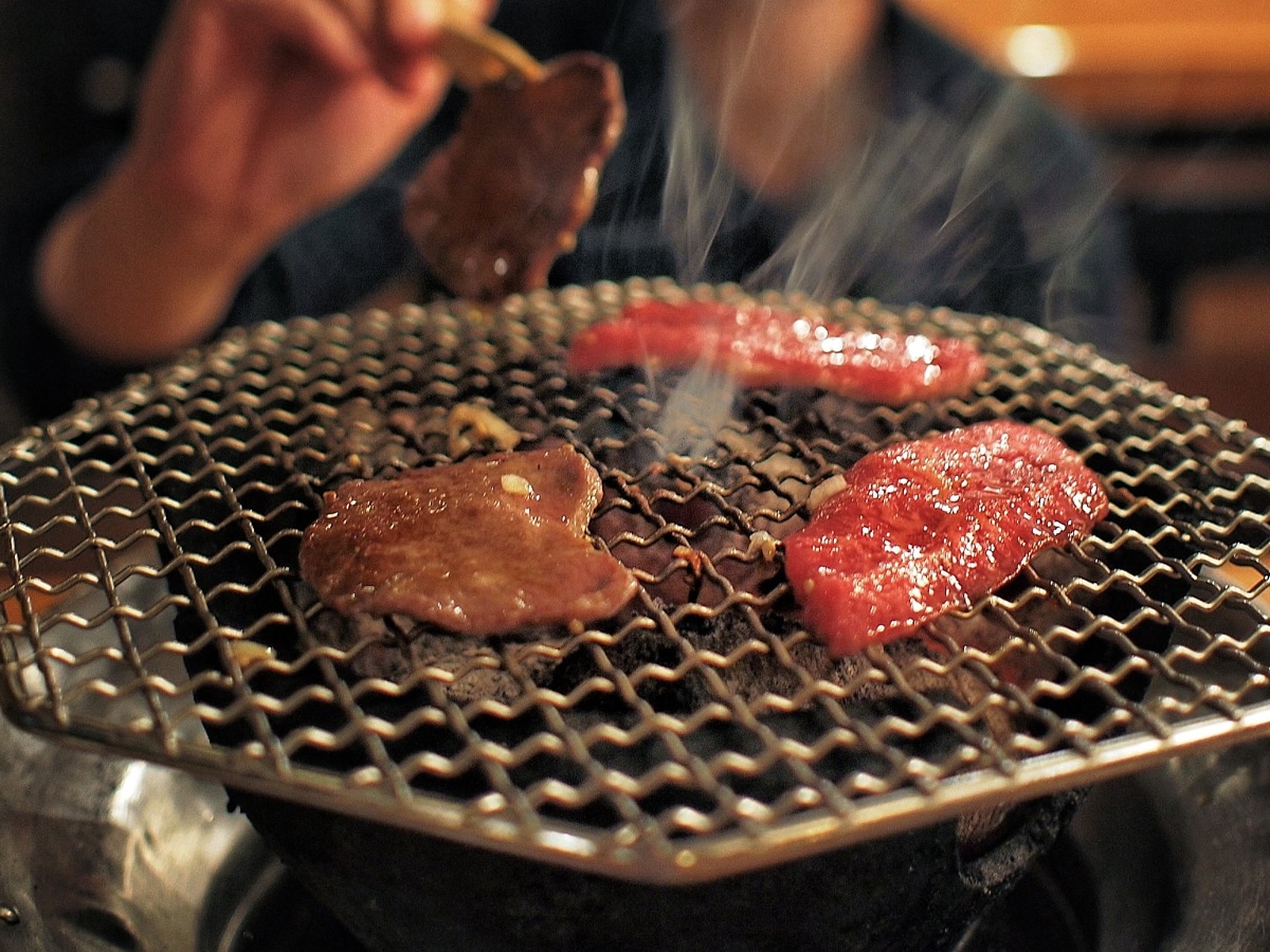 person grilling bbq