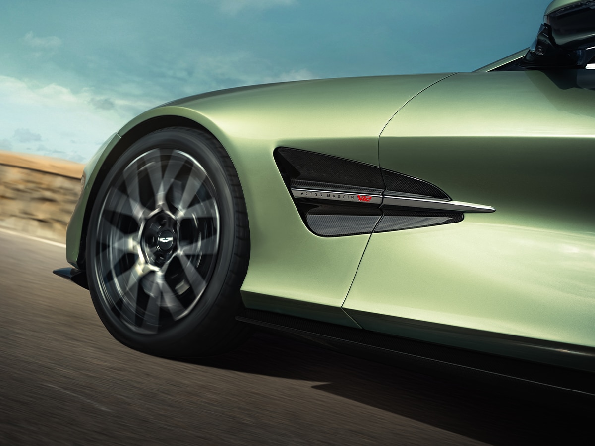Aston martin vanquish volante front wheel driving on road