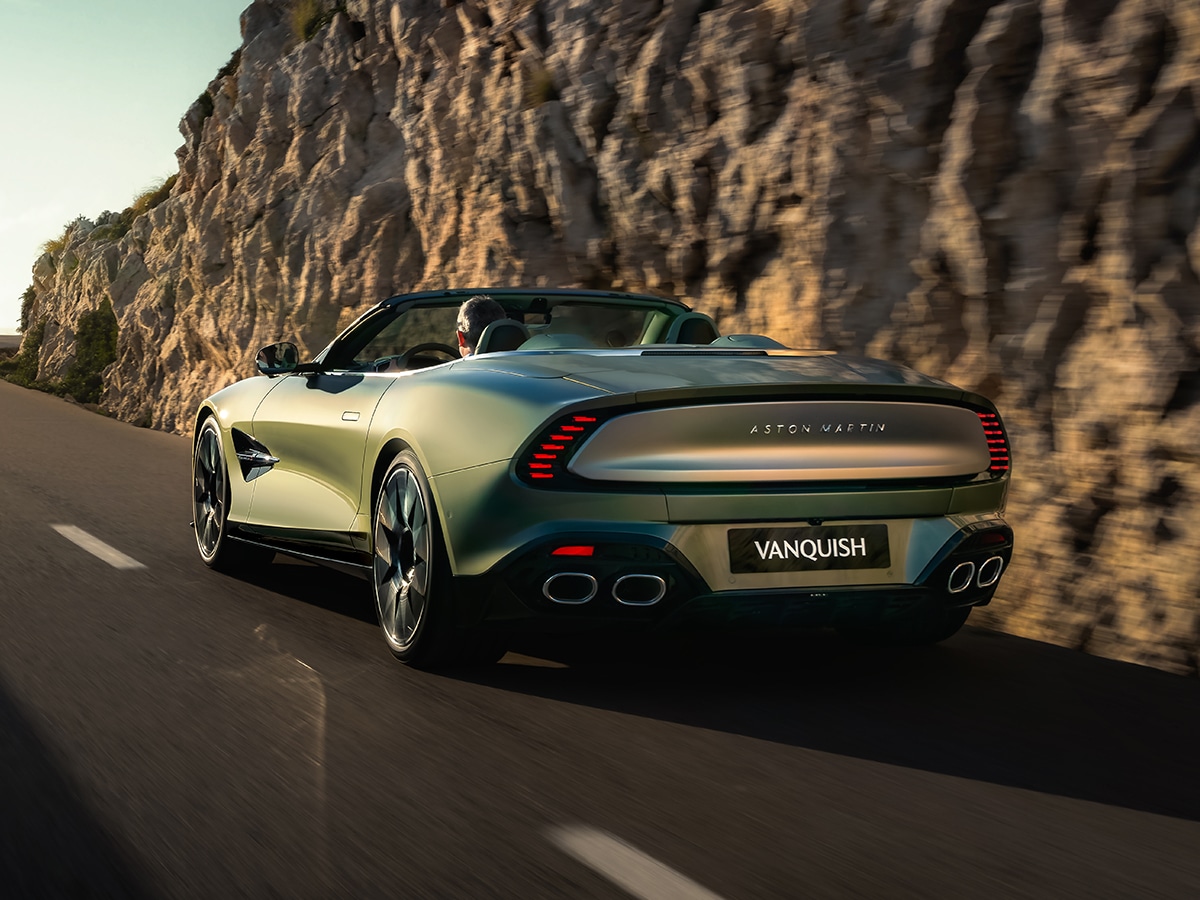 Aston martin vanquish volante rear three quarter driving on road