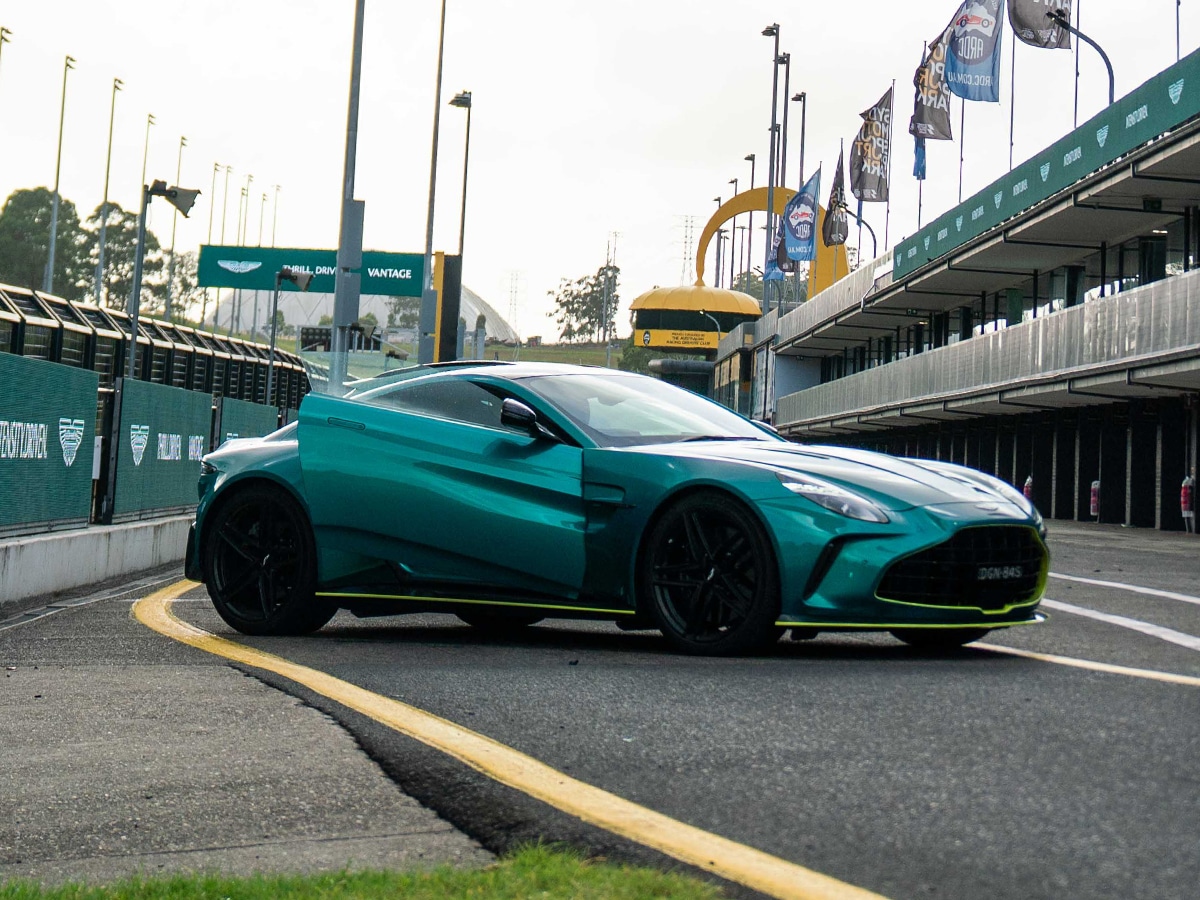 Aston martin vantage door open in pits