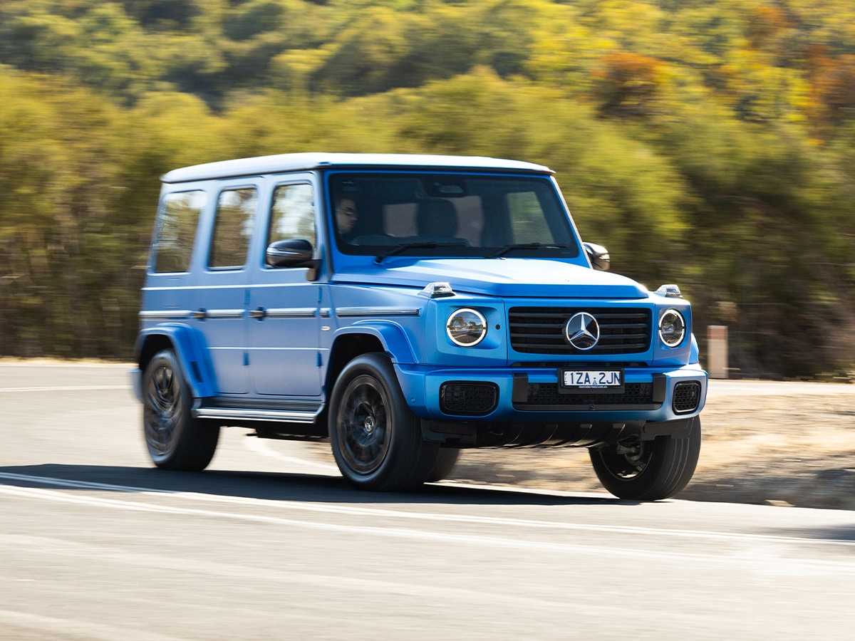 Mercedes benz g 580 with eq technology front end driving through corner