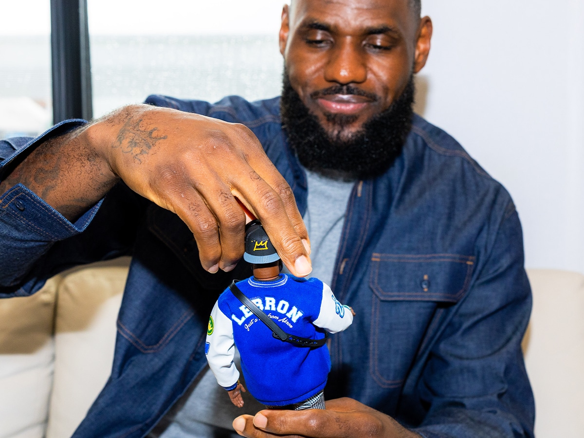 Lebron james ken doll holding in hand