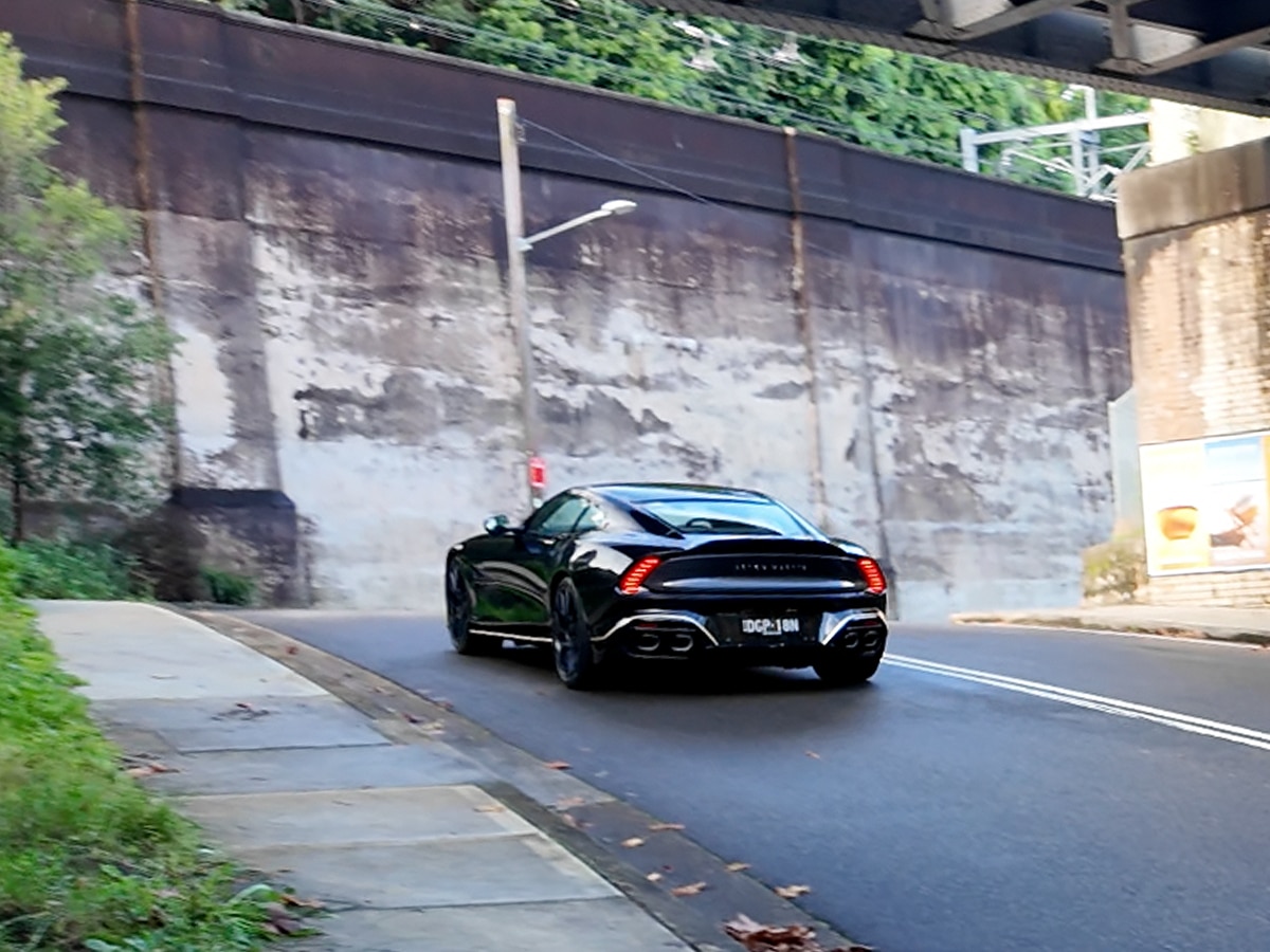 2025 aston martin vanquish rear end on road