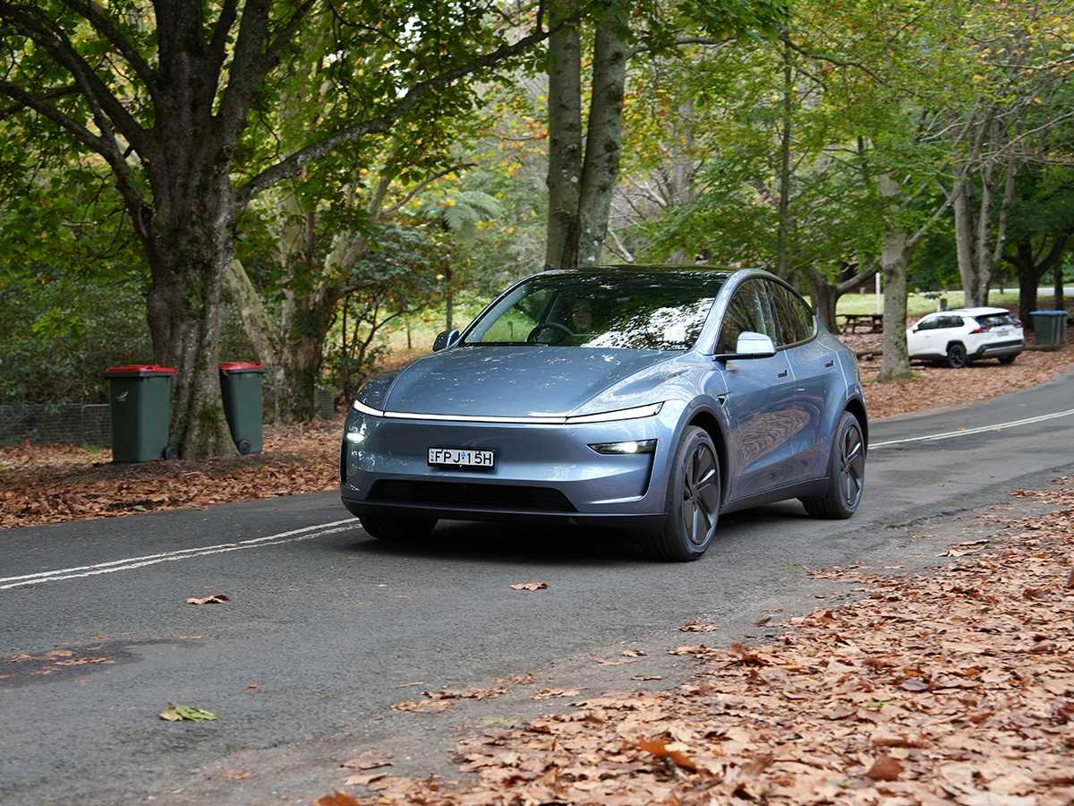 Tesla model y driving on the road