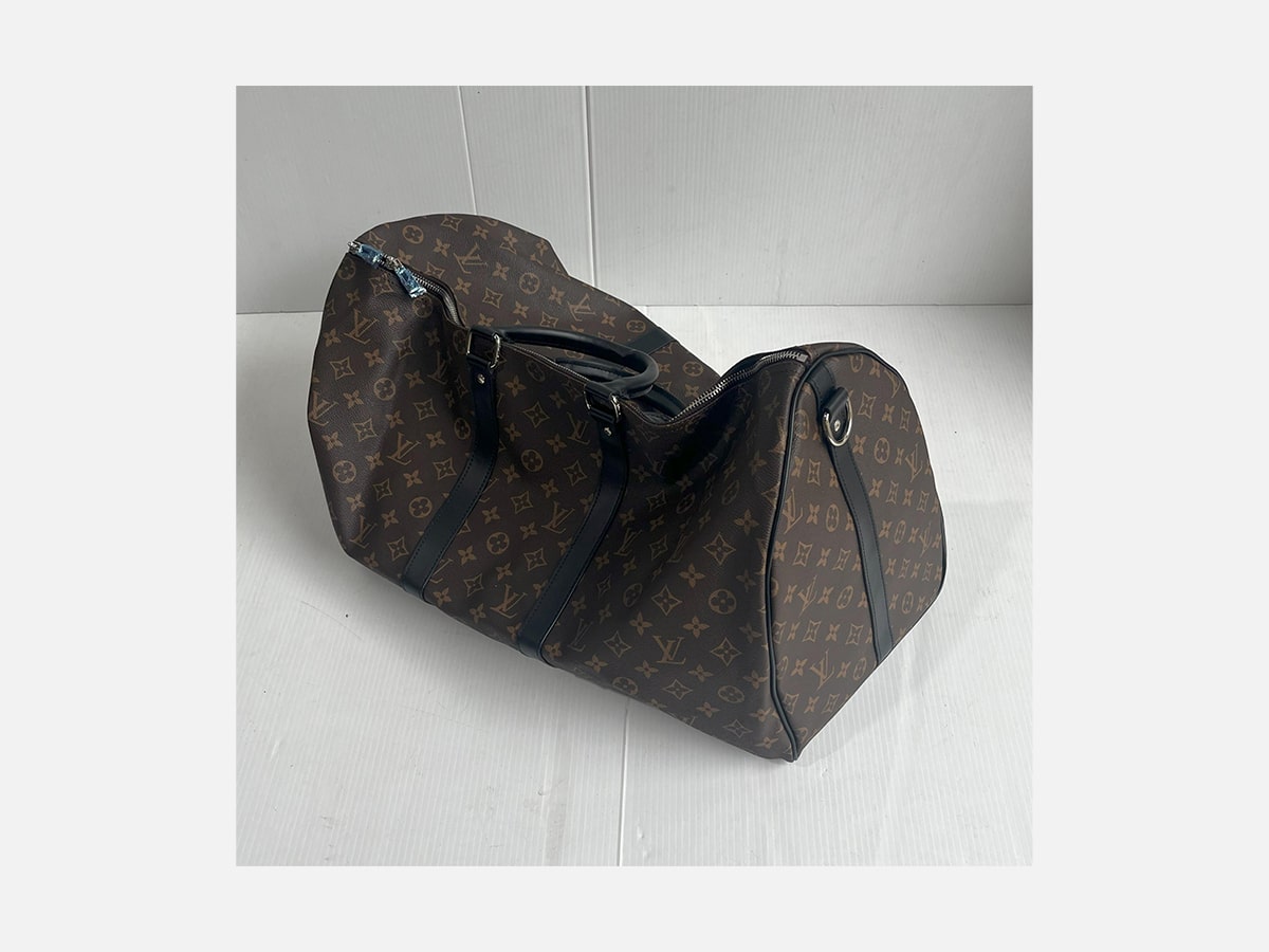 Lot 4022 a travel duffel bag marked louis vuitton